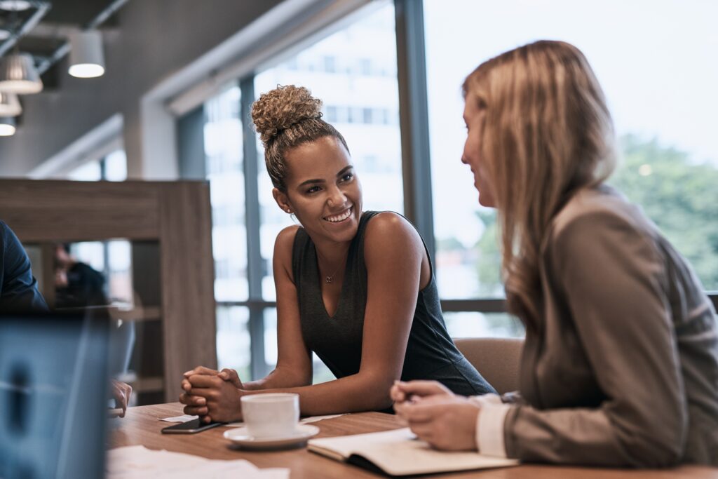 two women networking at an event